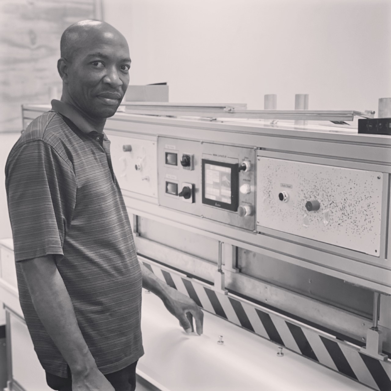 A man standing in front of an oven.