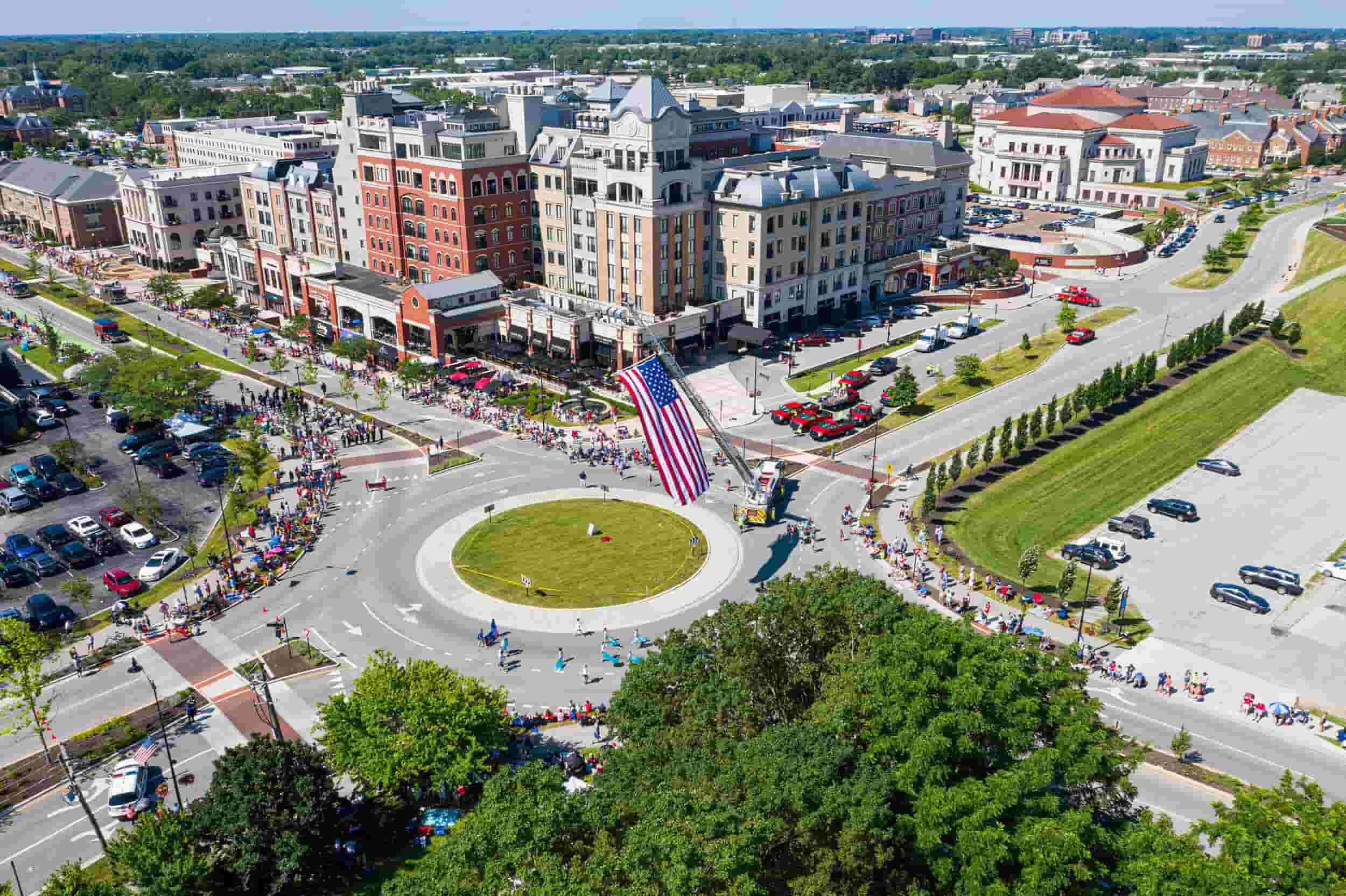 A large crowd of people gathered in the center of a city.