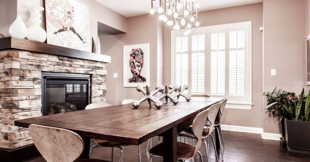 A dining room table with chairs around it