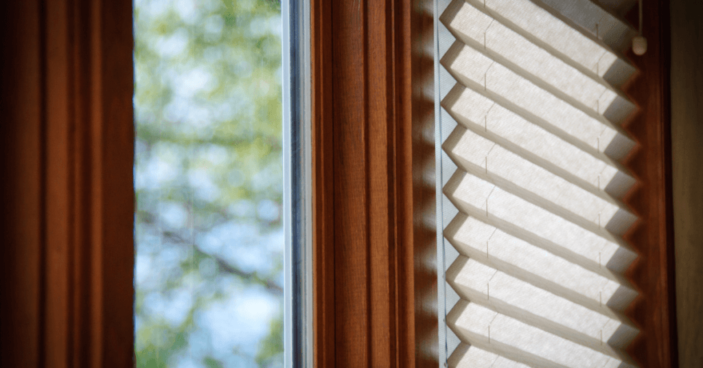 A window with blinds on the outside of it